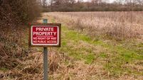 red wooden private property sign farm land no right of way no public access