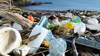 litter washed up on a beach in county cork, ireland.