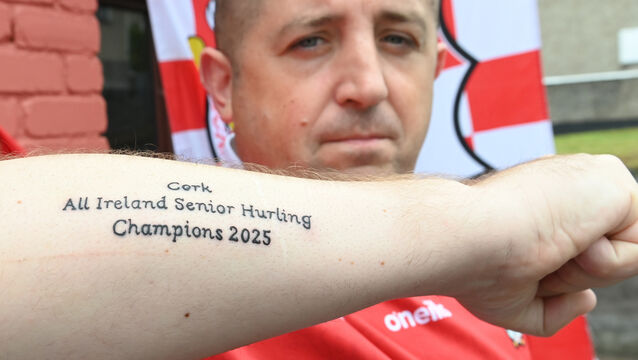 <p> Cork hurling fan Michael John Murphy, who got the words 'Cork All Ireland Senior Hurling Champions 2025' on his arm ahead of the game against Tipperary on Sunday, said he would be keeping the tattoo. Picture: Larry Cummins</p>