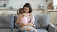 Loving mother hugging, comforting little daughter, enjoying tender moment