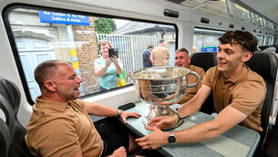 <p>THE SILVER SYMBOL: Star man David Clifford  with Kerry GAA head of athletic development Jason McGahan and Chairman Patrick O'Sullivan, mind the booty on the team's departure from Sallins and Naas on Monday. Pic: Ramsey Cardy/Sportsfile</p>
