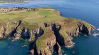 Ardmore's not so round tower on a cliff could be yours for €450,000