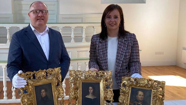 <p>Senior Cork City Council archivist Brian McGee and historian Michelle O'Mahony — who helped secure the Daniel MacCarthy Glas archive from the US — with some of the paintings which have been donated to the State.</p>
