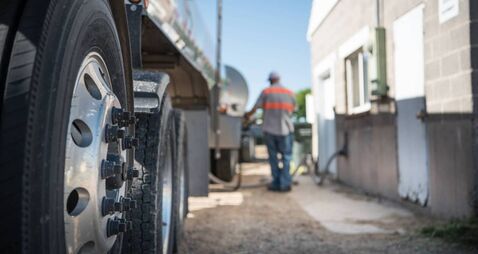 Farm and milk truck arriving