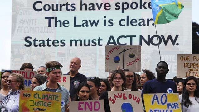 <p>Activists demonstrate last month outside the International Court of Justice in The Hague, Netherlands, ahead of an advisory opinion on what legal obligations nations have to address climate change and what consequences they may face if they don't. File photo: AP/Peter Dejong</p>
