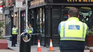 <p>Gardaí at the scene of the stabbing on Capel Street, Dublin, on July 29. Picture: Leah Farrell/ RollingNews.ie.</p>