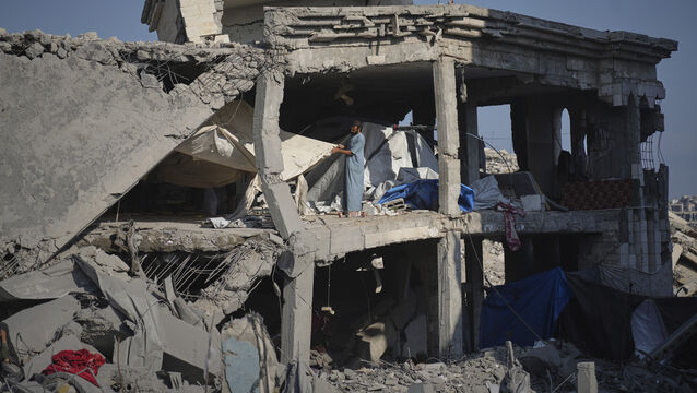 <p>People inspect the damage at the Sheikh Radwan al-Taba UNRWA clinic following an Israeli army bombardment in Gaza City. Picture: Jehad Alshrafi/AP</p>