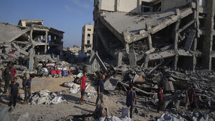 <p>People inspect the damage at the Sheikh Radwan al-Taba UNRWA clinic following an Israeli army bombardment in Gaza City on Wednesday. Picture: AP Photo/Jehad Alshrafi</p>
